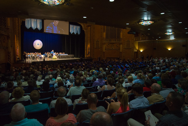 A closed-circuit screen helps broadcast the proceedings throughout the spacious theater.