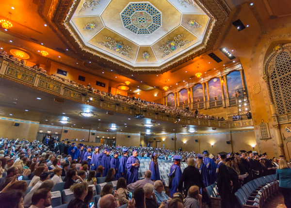 Degree candidates move into their rightful place in the center of attention.