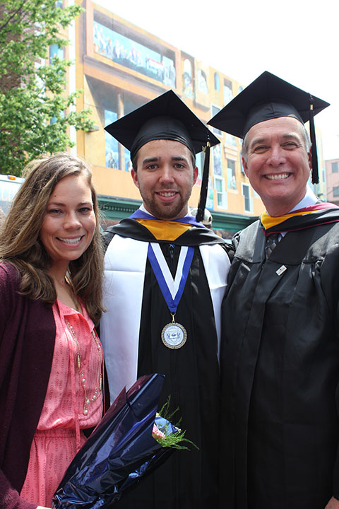 Bryan T. Robinson, of Gilbertsville, a plastics and polymer engineering technology graduate, reunites outdoors with supporters – including Timothy E. Weston, associate professor and department head.