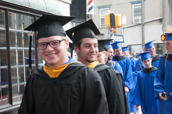 Anticipatory smiles are part of the pre-commencement wardrobe.