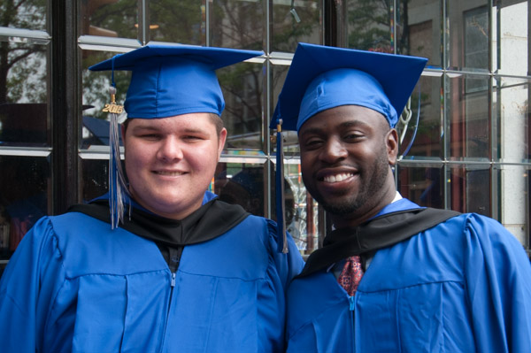 A handsome pair of smiles in front of The Genetti Hotel.