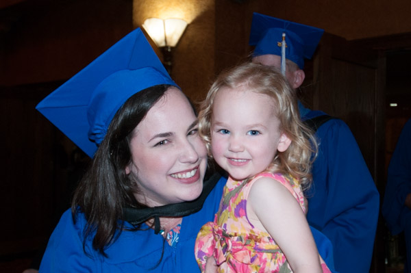 Mom, forest technology graduate Karen P. Sangl, and daughter leave the theater together.