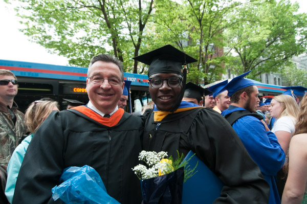 Plastics and polymer engineering technology grad Mohammed A Kanwi with John R. Bartomolucci, assistant professor of plastics technology