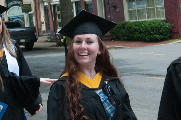Nursing graduate Julie H. Carr flashes a smile on her way to the ceremony … and then to work in an intensive care unit.