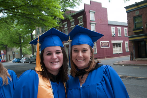 Classmates pause for a  final photo before the Saturday afternoon ceremony.