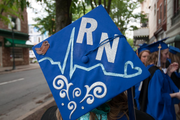 Since her mom wouldn’t allow her to wear her cowboy boots, this problem-solving cowgirl/nursing grad found another way to include them in her academic regalia.