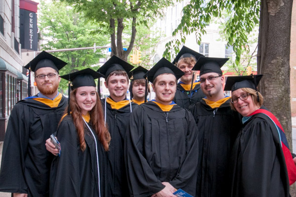 A beaming group: graduates of Web and interactive media, with faculty member Denise S. Leete. 