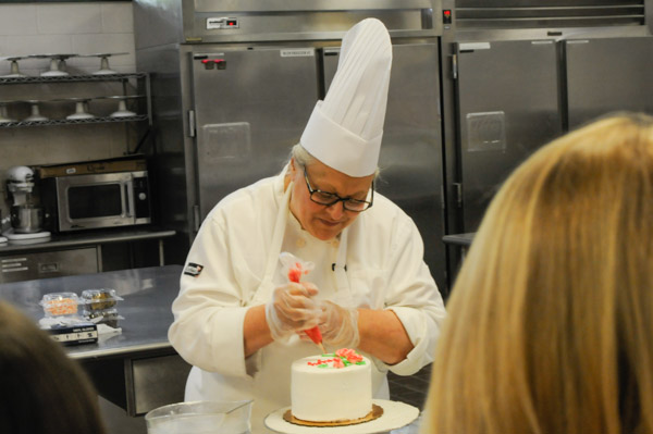– Chef Monica J. Lanczak, instructor of baking and pastry arts/culinary arts, offers a cake-decorating demonstration.
