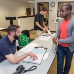 Shakeem J. Thomas (right), of Brooklyn, N.Y., joins Warney (left) and Corbin P. Snyder, of Harrisburg, in a busy downtown conference room.