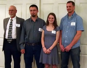 Penn College student Harley R. Heichel, a forest technology major from Wellsboro, celebrates her $1,000 industry scholarship with (from left) Cam Koons, Keystone Wood Products Association;  Erich R. Doebler, laboratory assistant for forest technology; and forestry instructor Eric C. Easton. (Photo provided)