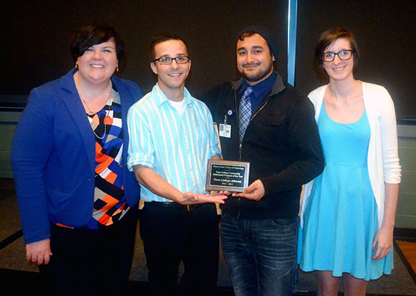 Advised by Sara H. Ousby (left), PC Alliance took the night's two newest awards. The organization was chosen as Penn College Community Betterment Program of the Year and its president, Wesley G. Ginnick (second from left) was recognized as a Student Leader Committed to Social Justice and Diversity.