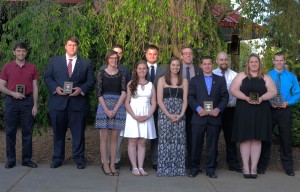 Plaques in hand, this year's recipients of Penn College Awards pose for photos outside Le Jeune Chef.