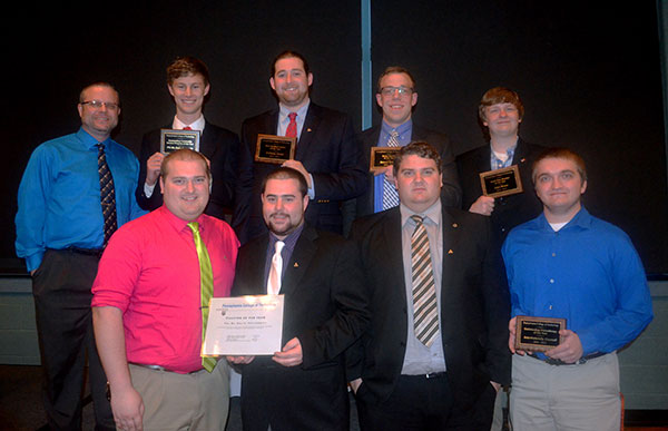 The brothers of Phi Mu Delta fraternity, some of whom were individually honored during the evening, join adviser Jeffrey D. Filko (top left) in being honored as Chapter of the Year and Outstanding Community Service Program of the Year. 