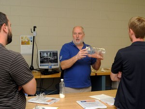 Jerry Ramsey, owner of Akro-Plastics in Kent, Ohio, shares his expertise in an adjacent lab.