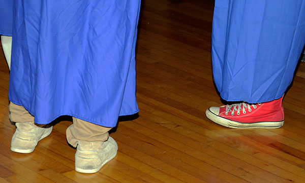 Accenting the requisite graduation gown with something decidedly less uniform