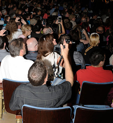 Many devices with one purpose: capturing their student favorites as they enter the theater.