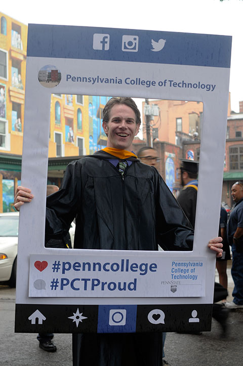 Chef Charles R. Niedermyer II, an alumnus and one of the weekend's teaching honorees, surrenders to a photographer's request.
