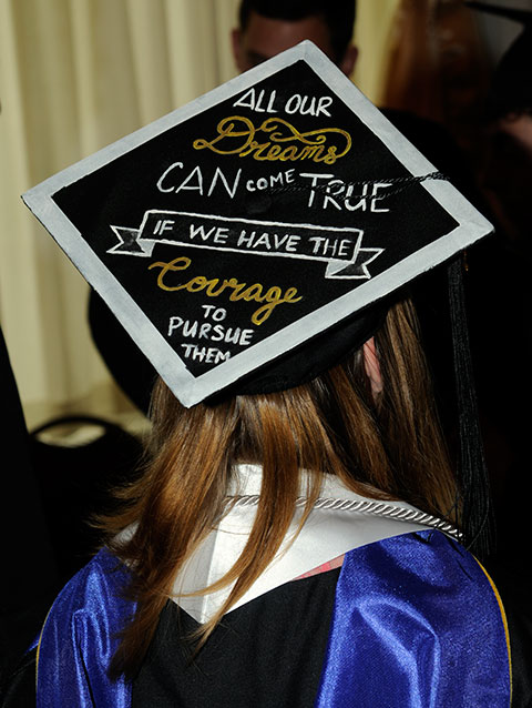 A quote from Walt Disney appropriately adorns the cap of Michelle M. Holzmann, a building science and sustainable design: architectural technology concentration student from Saylorsburg.