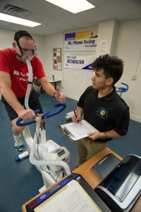 Penn College student Roberto Garcia Jr., who earned an associate degree in May, tracks a client’s performance using a V02 max calculator. The college’s exercise science major educates students in exercise physiology and how the body reacts to movement.