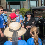 Vehicle owner Patricia B. Swigart gives a detailed talk to the youth judges about the vehicle, while portraying its significant owner, Eleonora Randolph Sears. Penn College students, in period garb, enjoyed acting as her driver and mechanics.