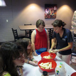 Sharon A. Berger works with Camp ESCAPE youngsters in CC Commons. 