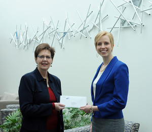 Teri MacBride (left), PPL’s regional affairs director, presents a $3,000 check to Elizabeth A. Biddle, Penn College’s director of corporate relations.