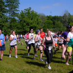Runners, walkers and trotters  – including Melanie A. Scaife, secretary to residence life at Rose Street Commons (in black at center right) – traverse Indian Park.