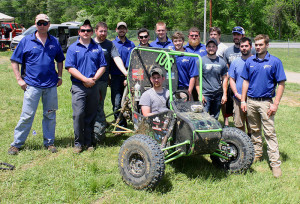 Penn College team members proudly surround their car during Baja SAE in Mechanicsville, Md. Penn College competed against 96 other teams from the United States and eight other countries.