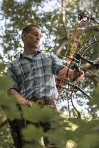 Leimbach poses with archery equipment in one of his product-demonstration photos. 
