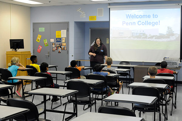 Admissions representative Emily A. Weaver challenges the perceptions of her young audience - many of them getting their first exposure to a college campus. 