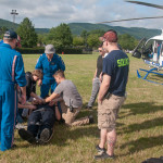 Students get hands-on practice, securing a classmate to be “loaded” onto the helicopter. 