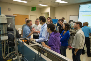 Penn College plastics technology professor Kirk M. Cantor (second from left) engages seminar participants.