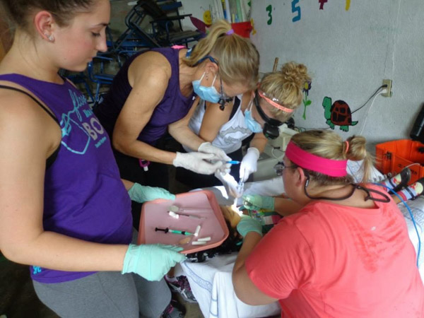 Students work together to place sealants. From left, Claudia N. Naylor, Rhonda J. Seebold, Chelsea B. Wanner and Carrie M. Derk.