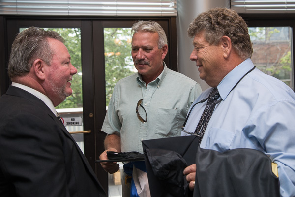 Before the ceremony, Peter is greeted in the Capitol Lounge by Richard L. Druckenmiller (center), assistant professor of building construction technology, and Marc E. Bridgens (right), dean of construction and design technologies. Peter has served on the college's Carpentry and Construction Technology Advisory Committee since 2006.