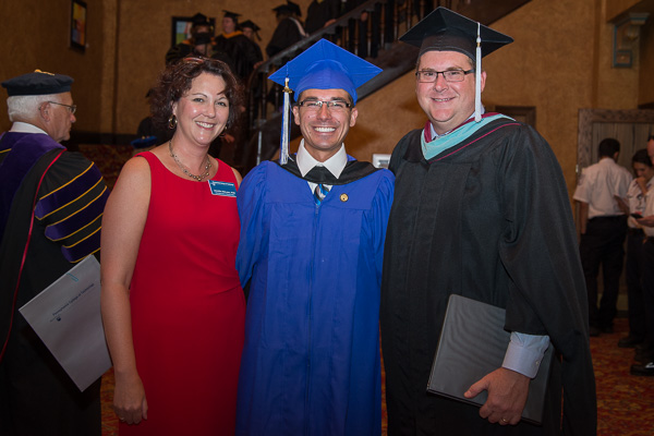Before the big event, student speaker Kyle G. Stavinski strikes a pose with Jennifer McLean, associate dean of student affairs, and Elliott Strickland, chief student affairs officer.