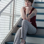 A line from one of Dalaney T. Vartenisian’s favorite spoken-word songs, a reminder to “embrace life,” is tattooed on her foot, while a botany-themed arm tattoo is a work in progress. 