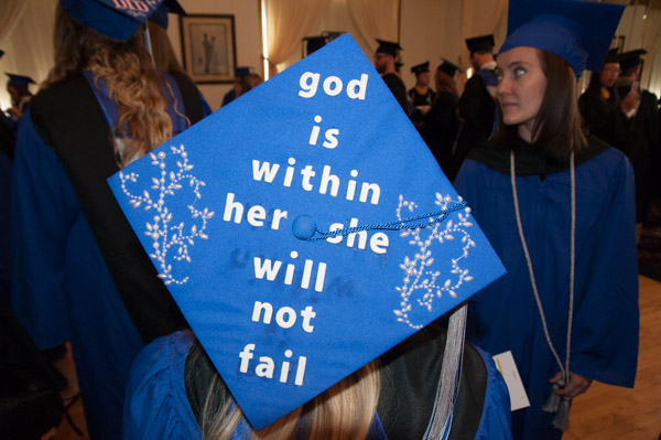 A cap shows a grad’s faith for the future.