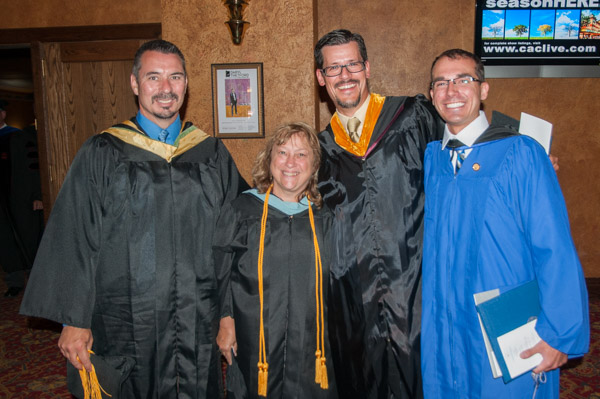 A justifiably proud foursome: the paramedic program’s Brady L. Breon, assistant professor; Mindy L. Carr, clinical director; Mark A. Trueman, director; and Kyle G. Stavinsky, of Elysburg, who was the day’s student speaker as he received his associate degree in emergency medical services.