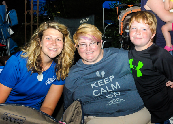 Stacey L. French (center), an applied human sevices major, watches the parade with her son Ethan and Katie L. Mackey, coordinator of off-campus living/commuter services.