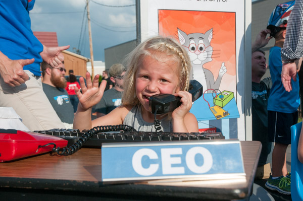 An enthusiastic future CEO is among “Future Wildcats” on the Penn College Grand Slam Parade float.