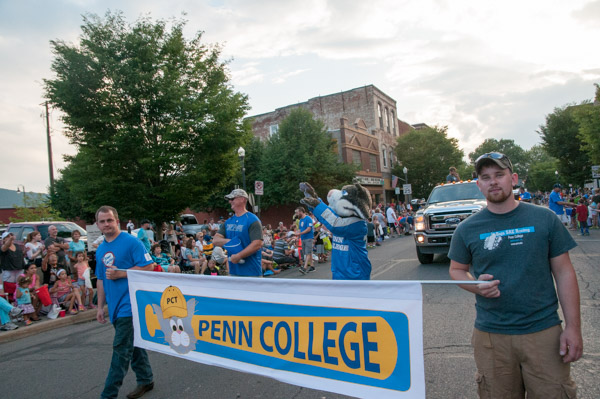The Penn College parade entry makes its way east on Fourth Street.