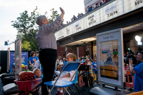 President Davie Jane Gilmour acknowledges fans on the Community Arts Center balcony.