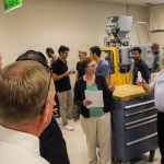 Anne K. Soucy, assistant professor of plastics technology, and Gary E. McQuay, engineering manager for the Plastics Innovation & Resource Center, show visitors the afternoon project for students in the Blow Molding course.