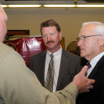 Sens. Vogel (center) and Yaw (right) talk with David R. Cotner, dean of industrial, computing and engineering technologies, in the college's welding laboratory.