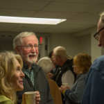 At the postlecture reception in Wrapture, professor emeritus Daniel J. Doyle – for whom the colloquia series is named – shares a laugh and conversation with audience members.