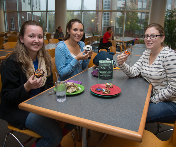 Scaring up some delicious desserts at the “boofet” are (from left): Erica L. Gause, a nursing student from Bloomsburg; Carly D. Turgeon, pre-dental hygiene, Hooversville; and Korryne E. Gordon, pre-applied health studies: radiography concentration, Easton. 