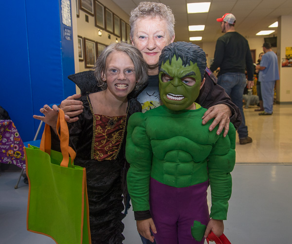 Elizabeth “Ann” Hodge, a dining services worker, scares up some fun with her grandkids. 