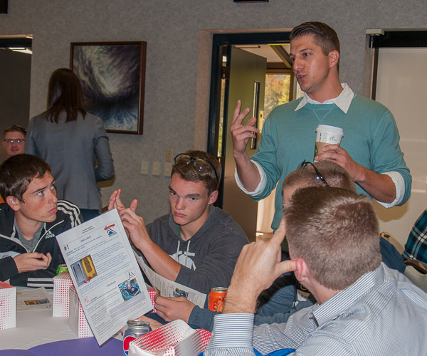 Seth Alberts, third-generation owner of Ralph S. Alberts Co., talks with students about his company’s proposed problem: How to efficiently replace foam padding for roller coasters from all across the U.S. in the four-month off-season and reduce shipping of the steel parts that must be re-padded.