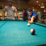 Pool-shooting students enjoy inviting environment.