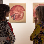Gallery manager Penny G. Lutz (left) talks with Joanne Landis, a regional artist who has a studio at The Pajama Factory.
